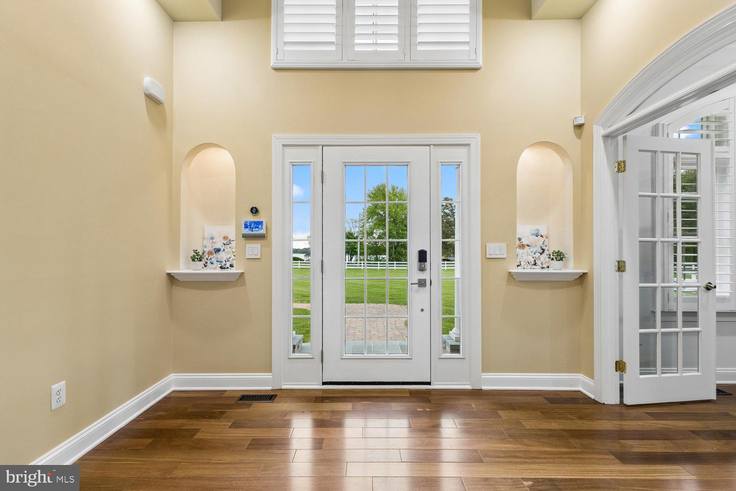 313 Wye Road Queenstown, MD 21658 - Photo 29 of 132 Inviting entryway with serene outdoor views.