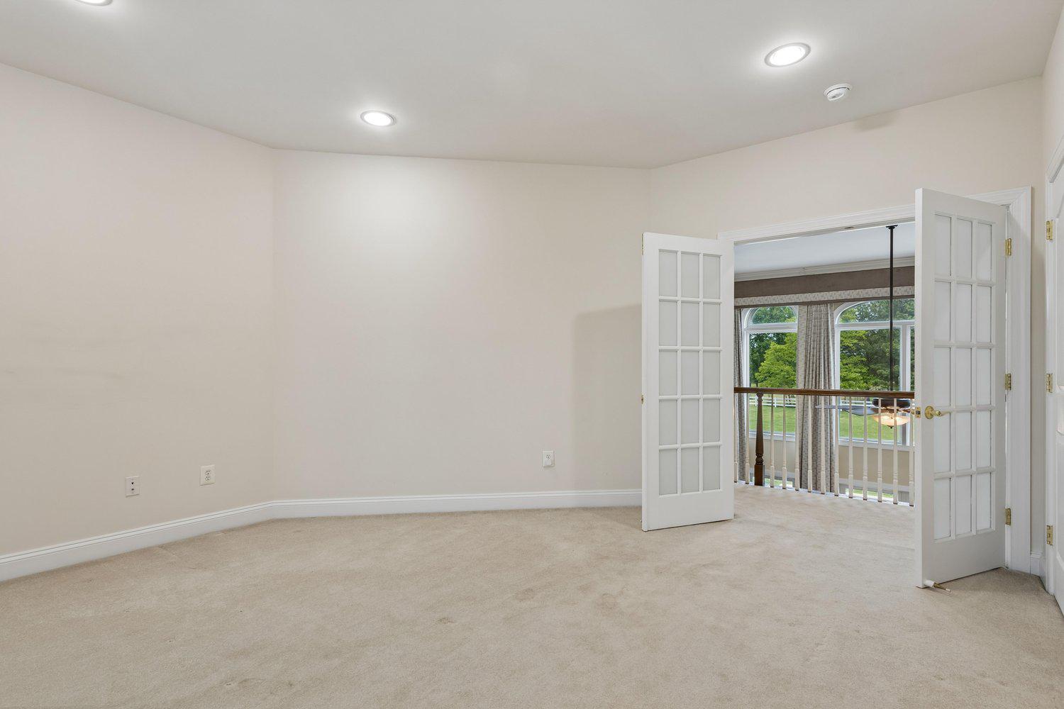 313 Wye Road Queenstown, MD 21658 - Photo 76 of 132 Bright and airy bedroom suite with elegant doors.