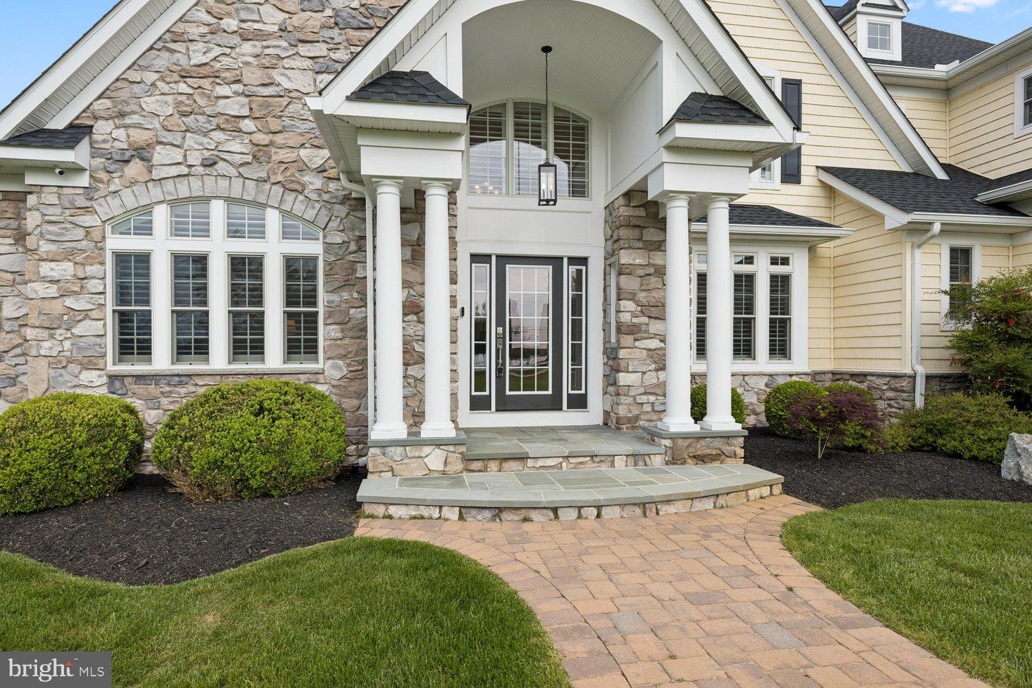 313 Wye Road Queenstown, MD 21658 - Photo 96 of 132 Elegant stone entrance with lush greenery.