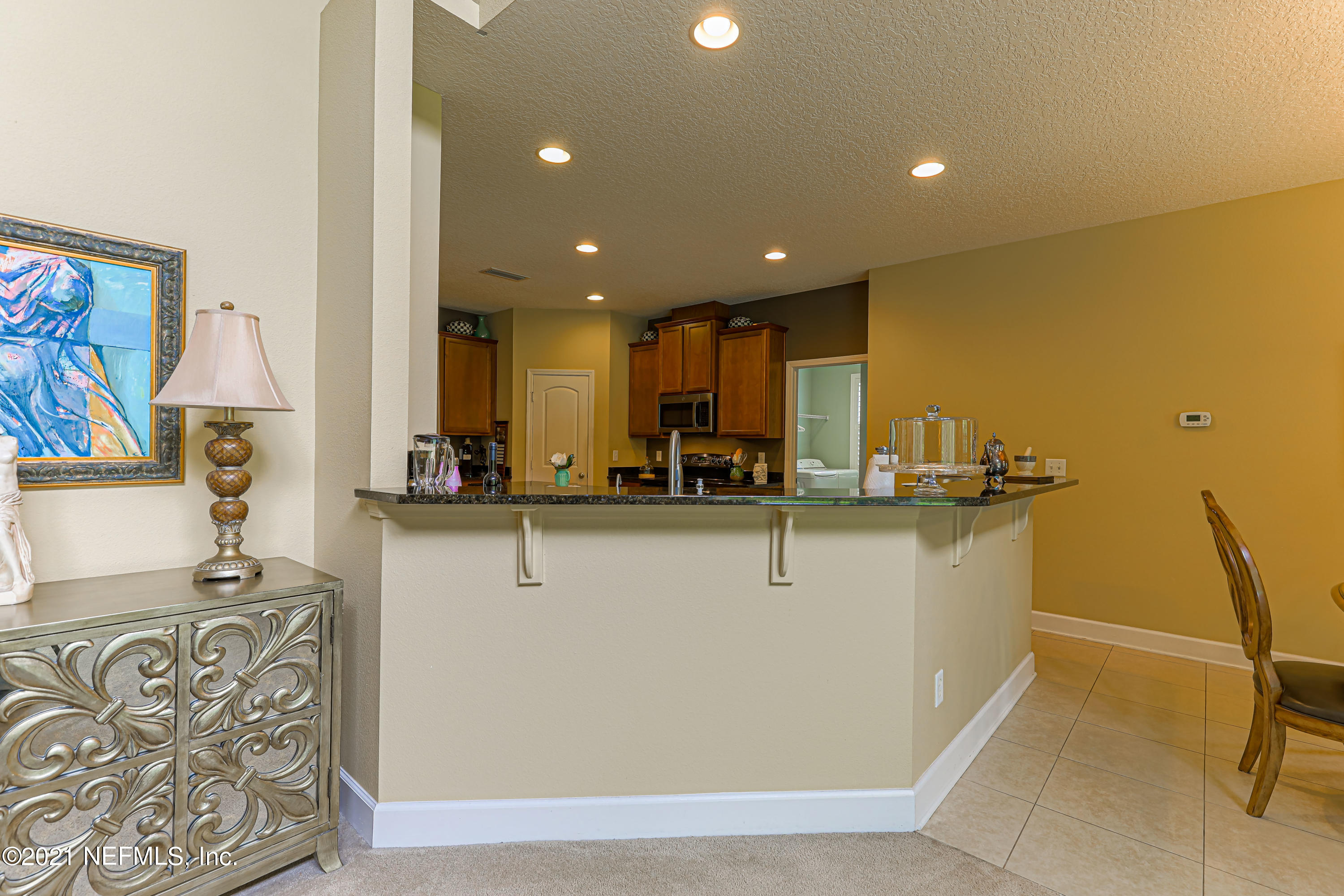132 North Atherley Road St. Augustine, FL 32092 - Photo 12 of 40 a view of kitchen with stainless steel appliances kitchen island sink stove and refrigerator
