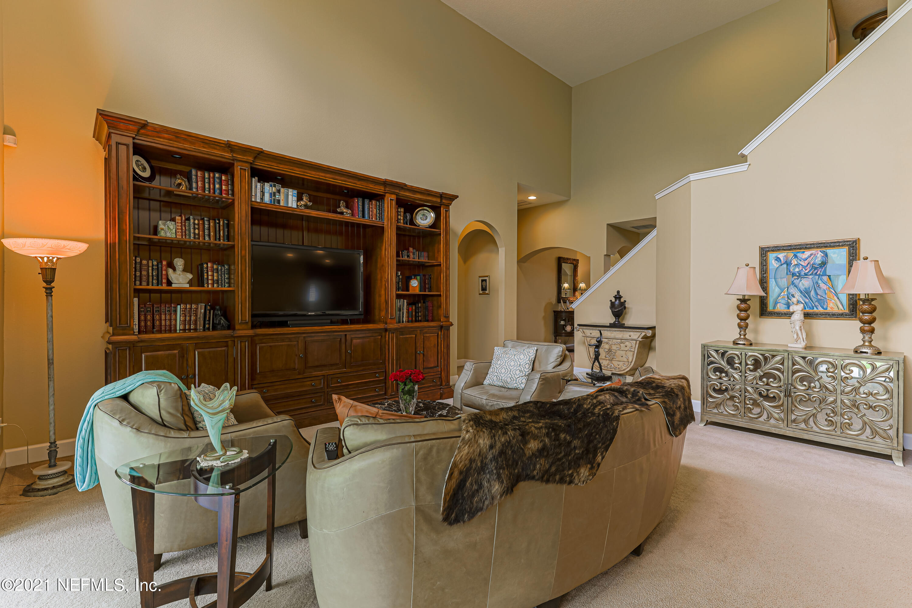 132 North Atherley Road St. Augustine, FL 32092 - Photo 15 of 40 a living room with furniture and a flat screen tv