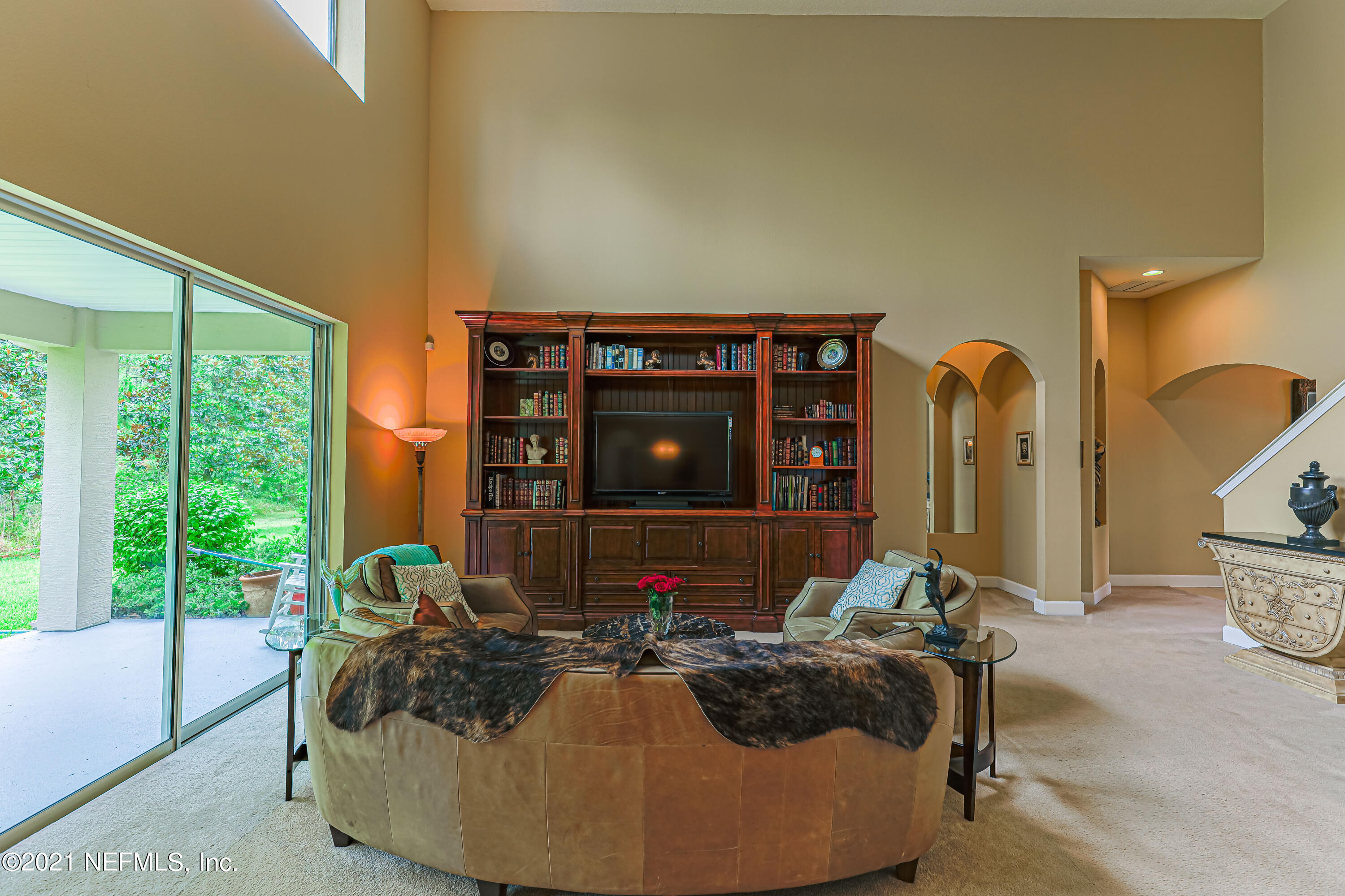 132 North Atherley Road St. Augustine, FL 32092 - Photo 16 of 40 a bed room with a bed and a large window