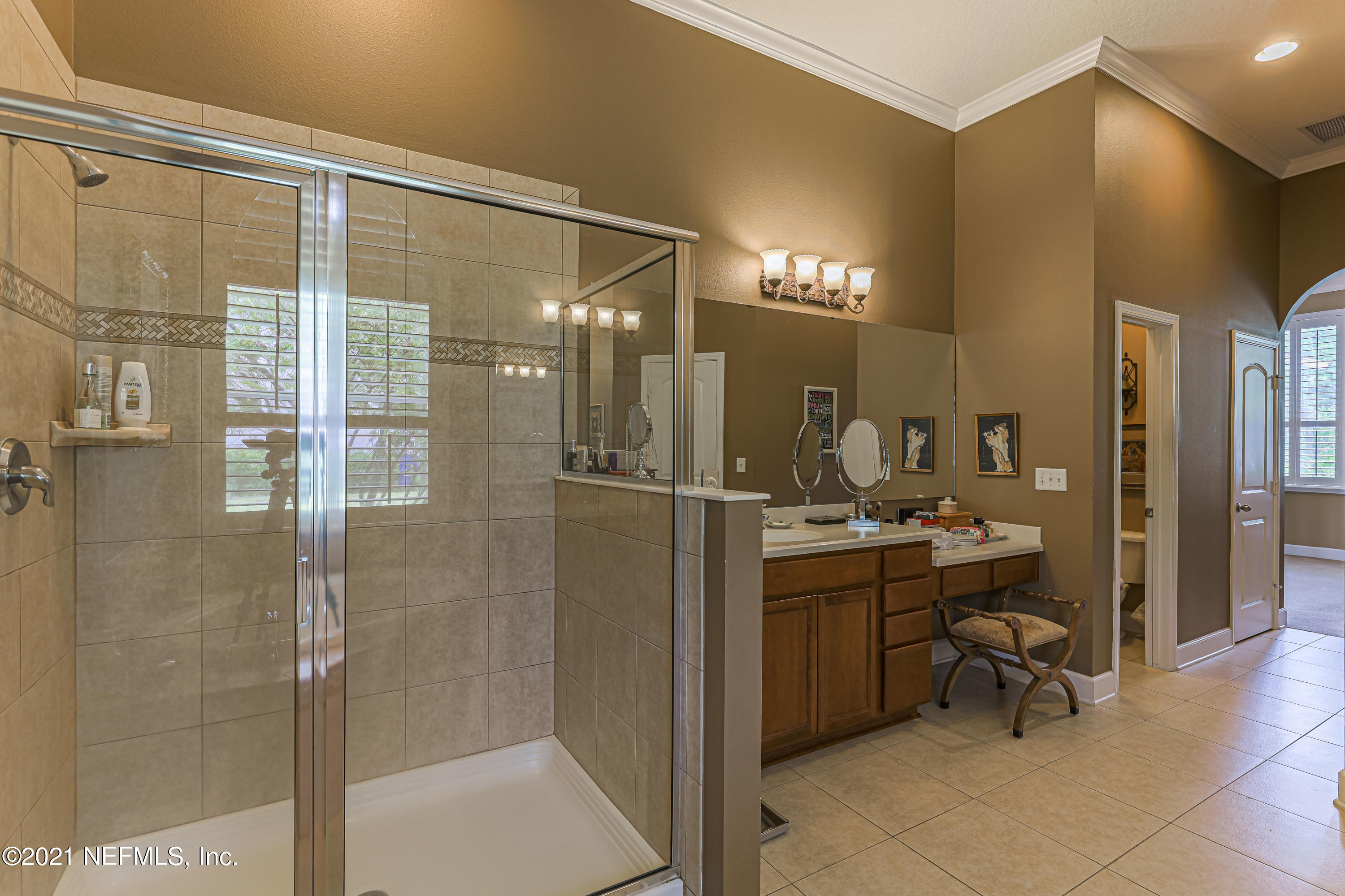 132 North Atherley Road St. Augustine, FL 32092 - Photo 27 of 40 a bathroom with a sink and a mirror