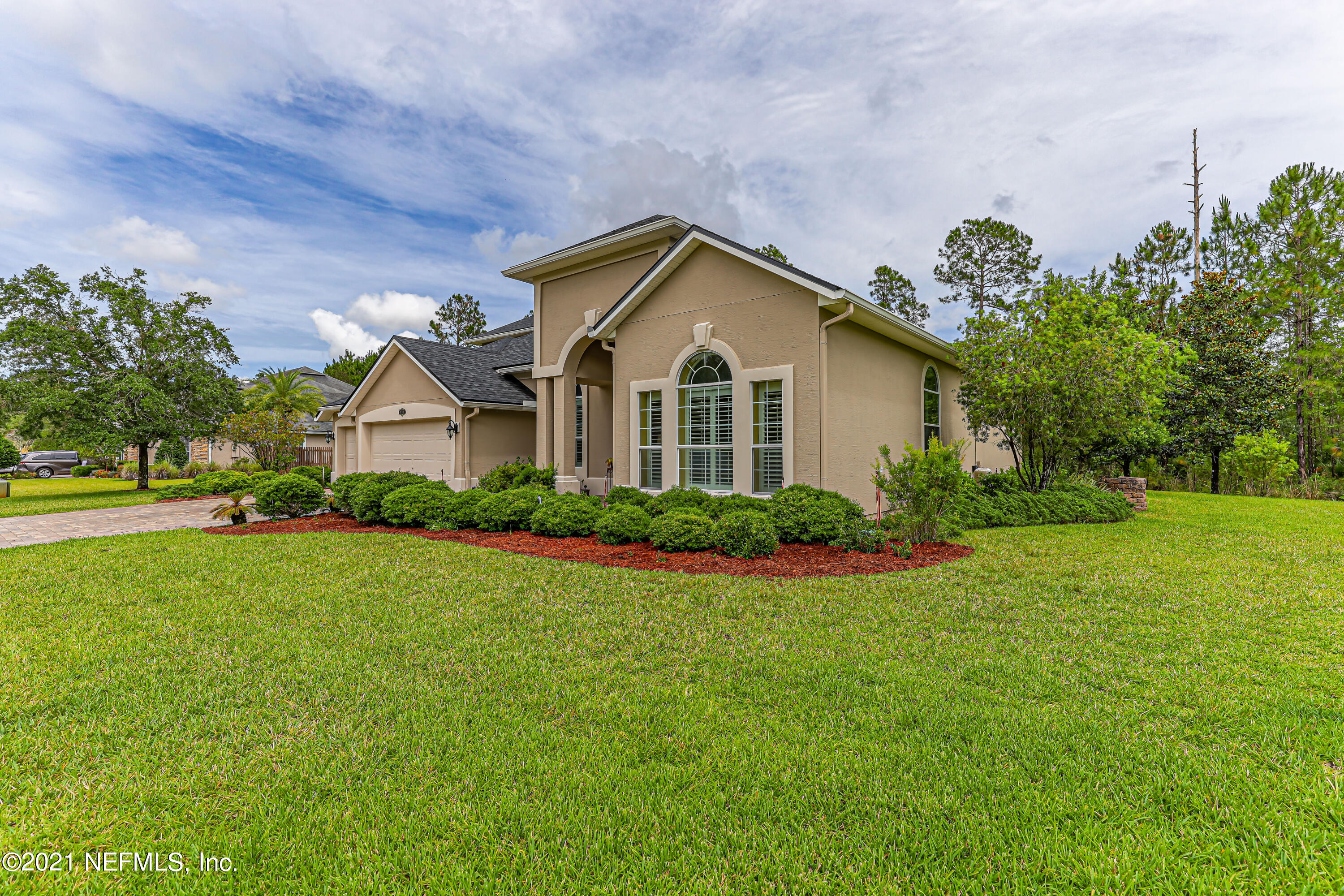 132 North Atherley Road St. Augustine, FL 32092 - Photo 3 of 40 a front view of a house with garden