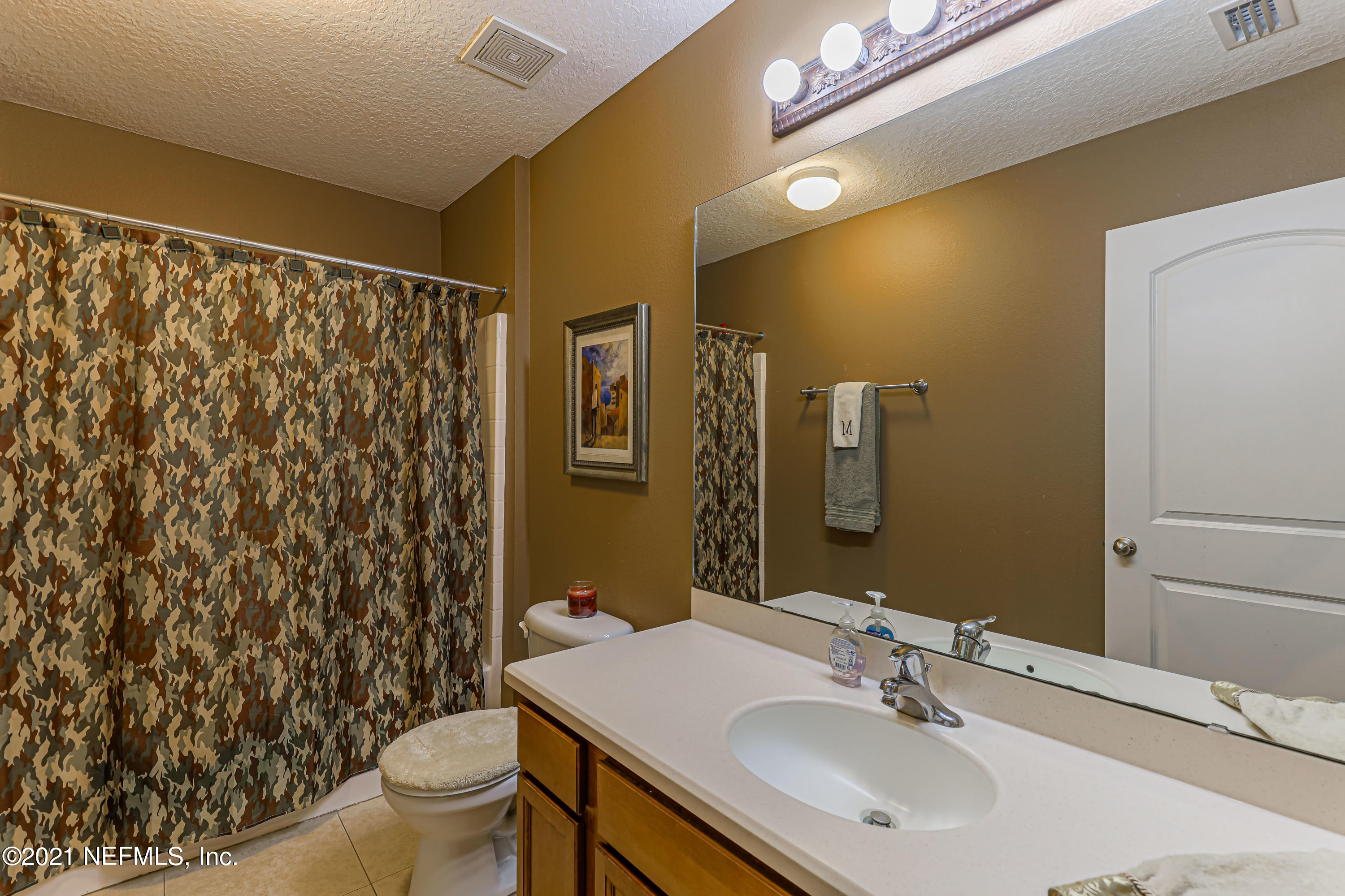 132 North Atherley Road St. Augustine, FL 32092 - Photo 31 of 40 a bathroom with a sink toilet and shower