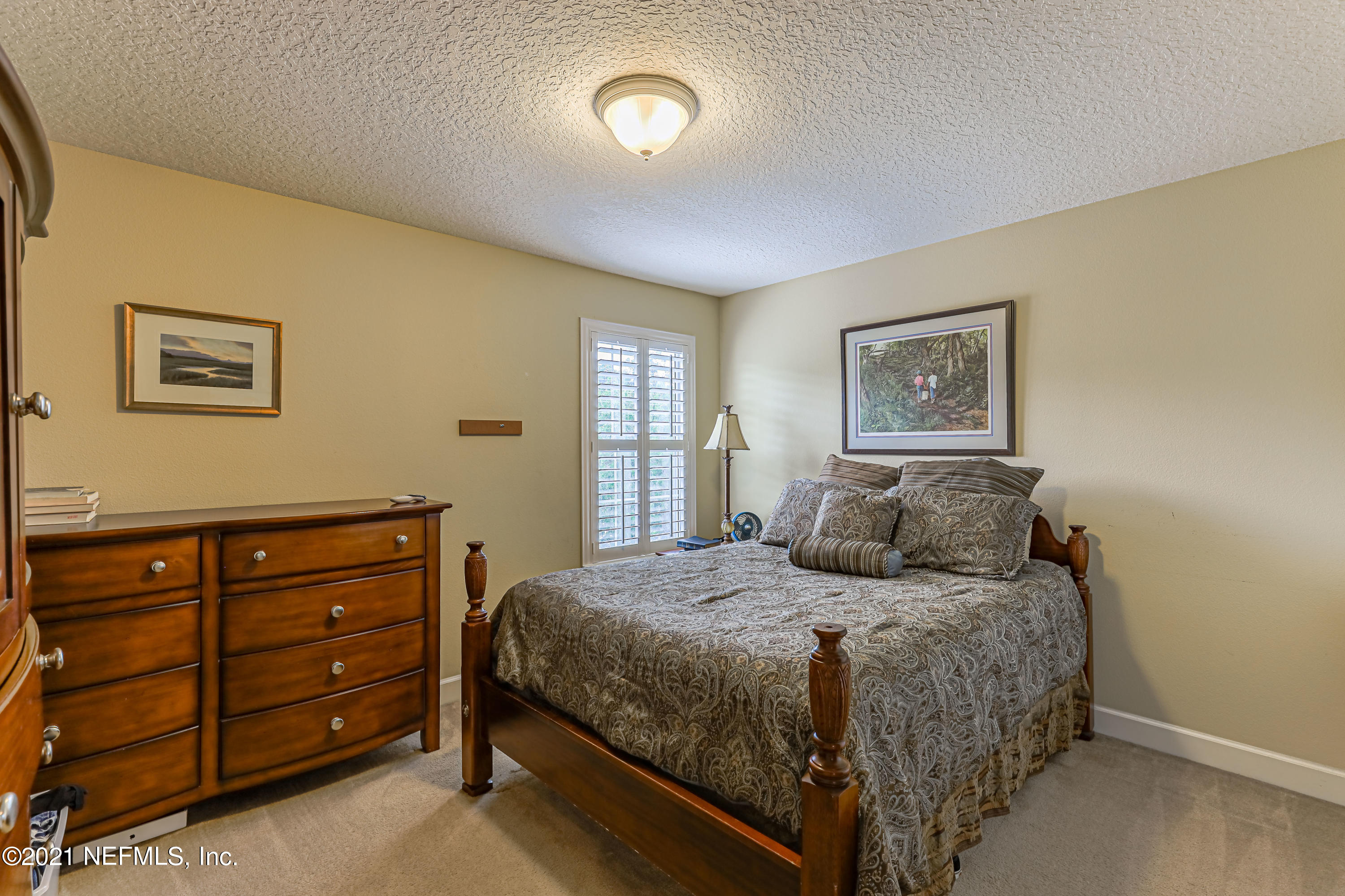 132 North Atherley Road St. Augustine, FL 32092 - Photo 34 of 40 a bedroom with a bed and a window