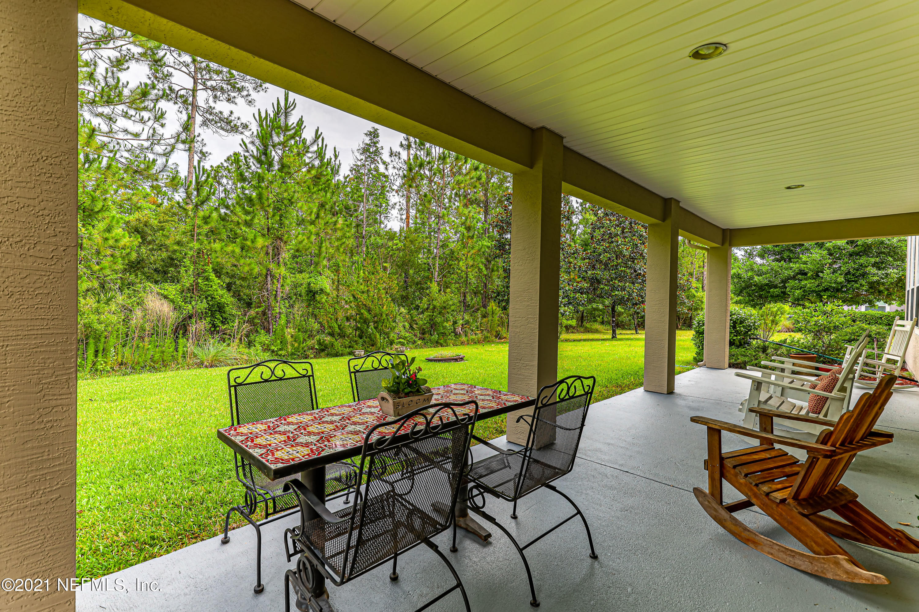 132 North Atherley Road St. Augustine, FL 32092 - Photo 36 of 40 a view of an outdoor dining space with furniture and garden