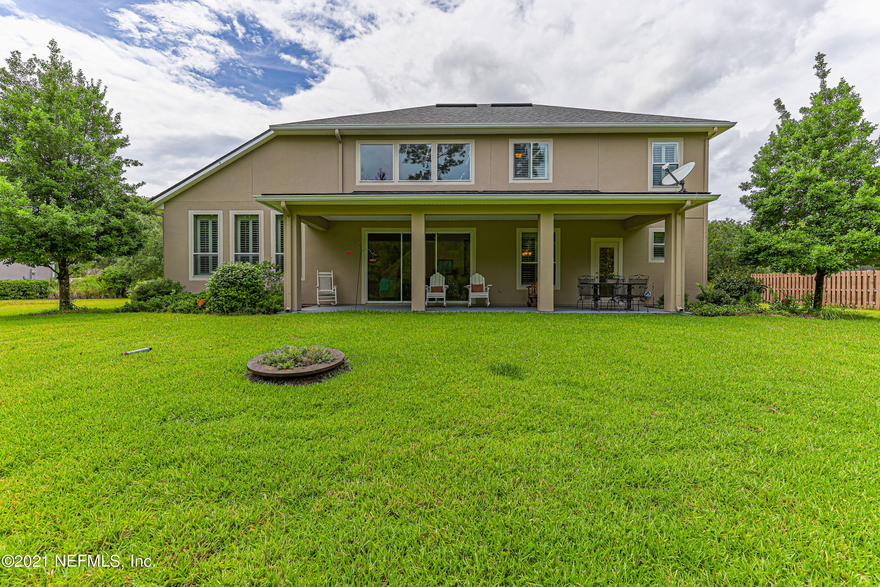 132 North Atherley Road St. Augustine, FL 32092 - Photo 39 of 40 a view of a white house with a yard
