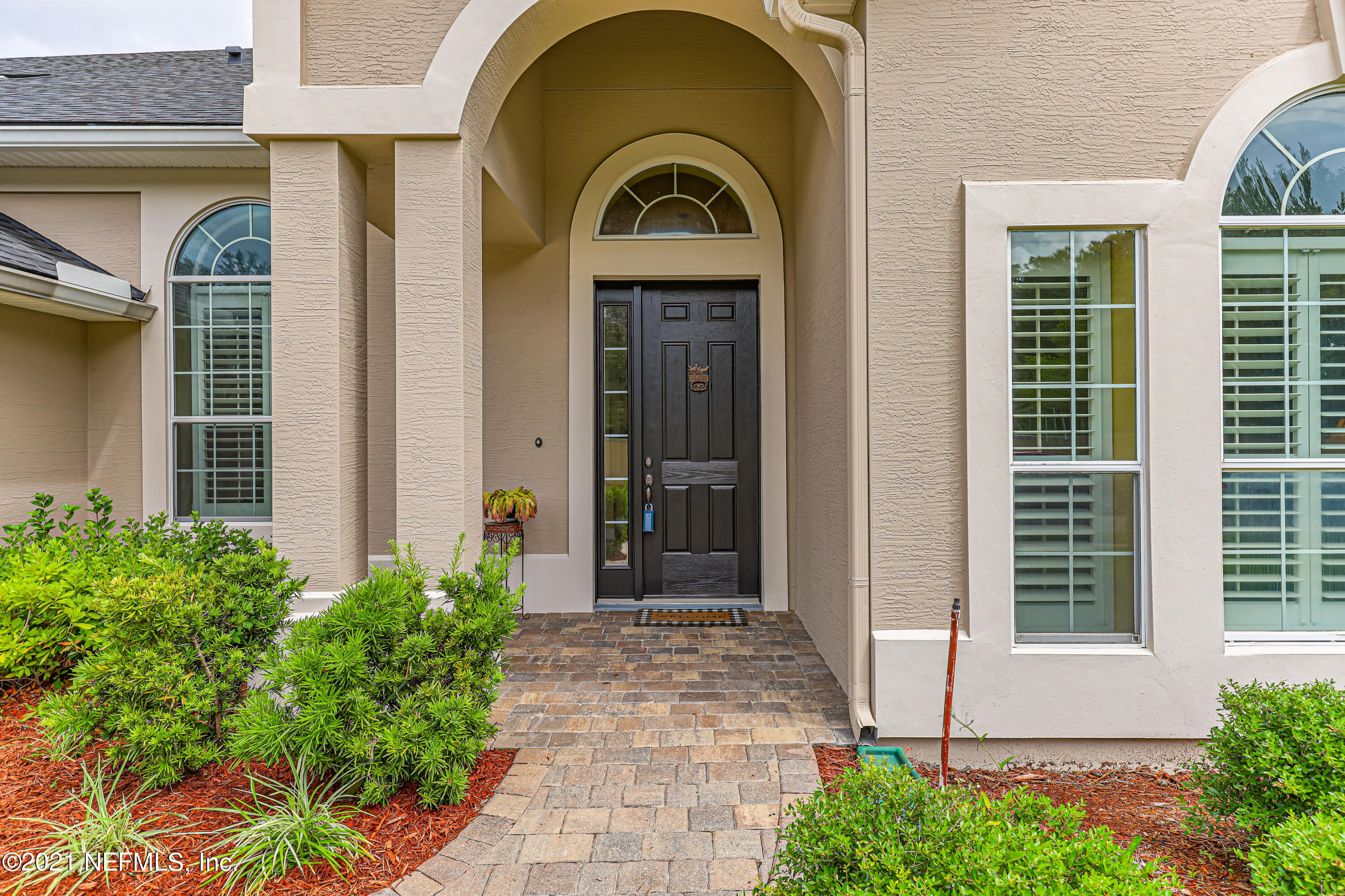 132 North Atherley Road St. Augustine, FL 32092 - Photo 6 of 40 a view of entrance of the house with potted plants