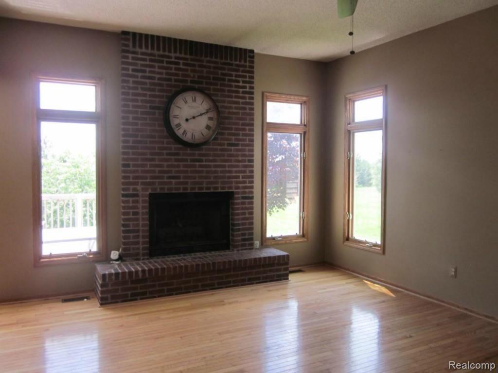 16800 31 Mile Road Ray, MI 48096 - Photo 4 of 12 #4 Family room with fireplace.jpg