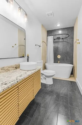 an empty room with wooden floor and closet