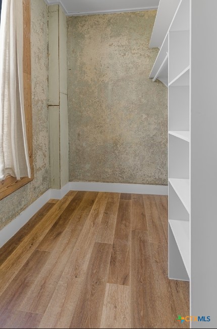 123 West May Street, Unit 1 Yoakum, TX 77995 - Photo 18 of 21 a view of a room with wooden floor and shower