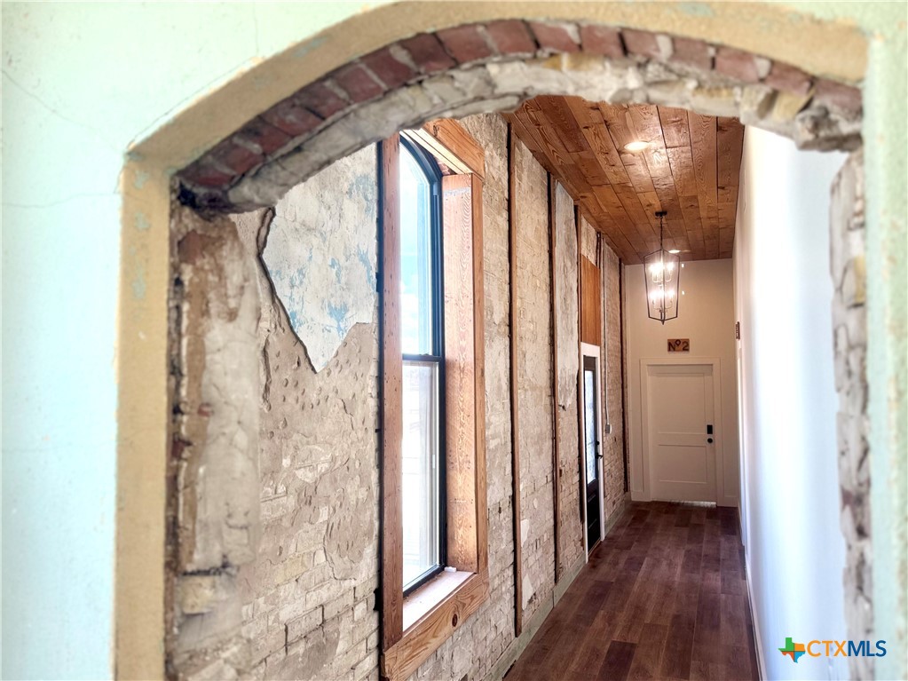 123 West May Street, Unit 1 Yoakum, TX 77995 - Photo 9 of 21 a view of a glass door with wooden floor