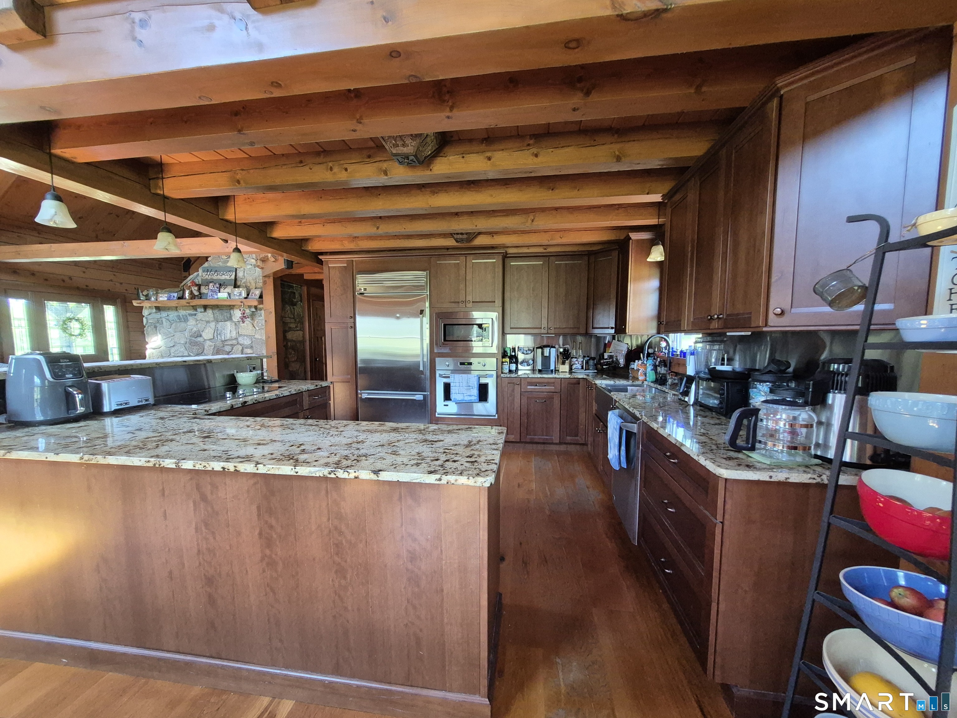 46 Cemetery Road Canterbury, CT 06331 - Photo 20 of 40 a kitchen with granite countertop a sink a counter top space and cabinets