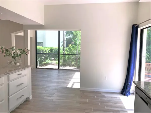 a view of a room that has a large window