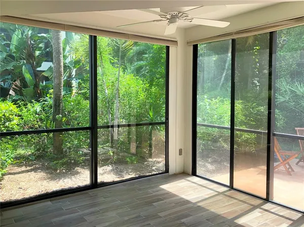 a lobby with furniture and floor to ceiling window