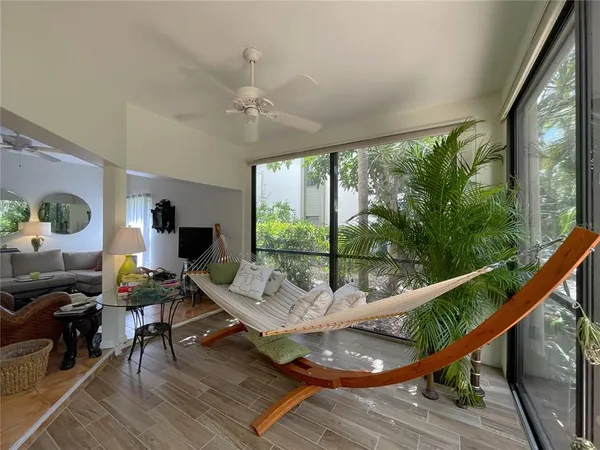 an empty room with windows and cabinet