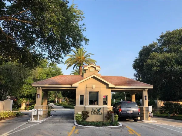 a view of empty room with wooden floor and floor to ceiling window
