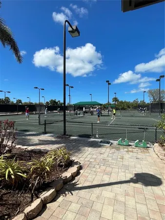 a view of swimming pool with lawn chairs