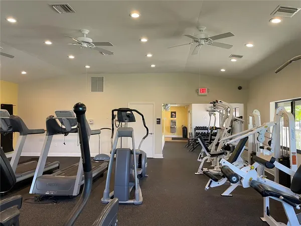 a view of a balcony with wooden floor and outdoor seating