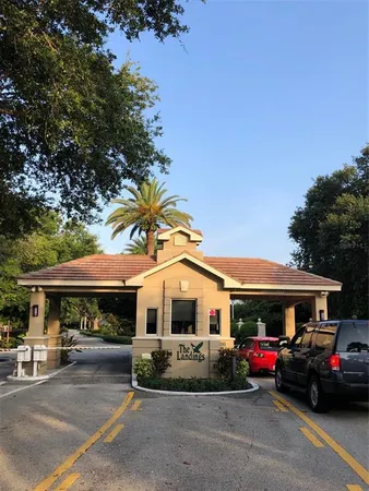 a view of a backyard with plants and patio