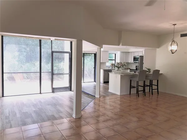 a kitchen with refrigerator and sink