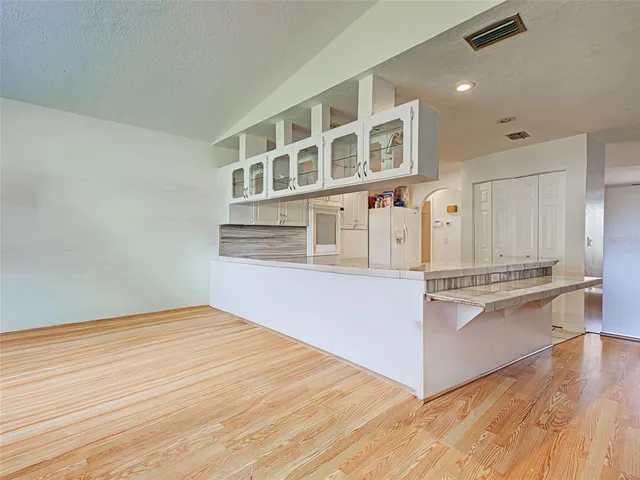 a kitchen with stainless steel appliances granite countertop a stove and a sink