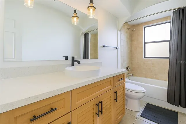 a bathroom with a sink a toilet and a bathtub