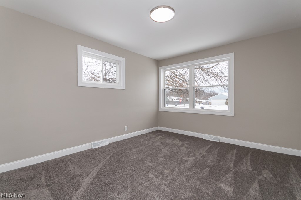 4980 Emmet Road Lyndhurst, OH 44124 - Photo 24 of 39 Unfurnished room with dark carpet