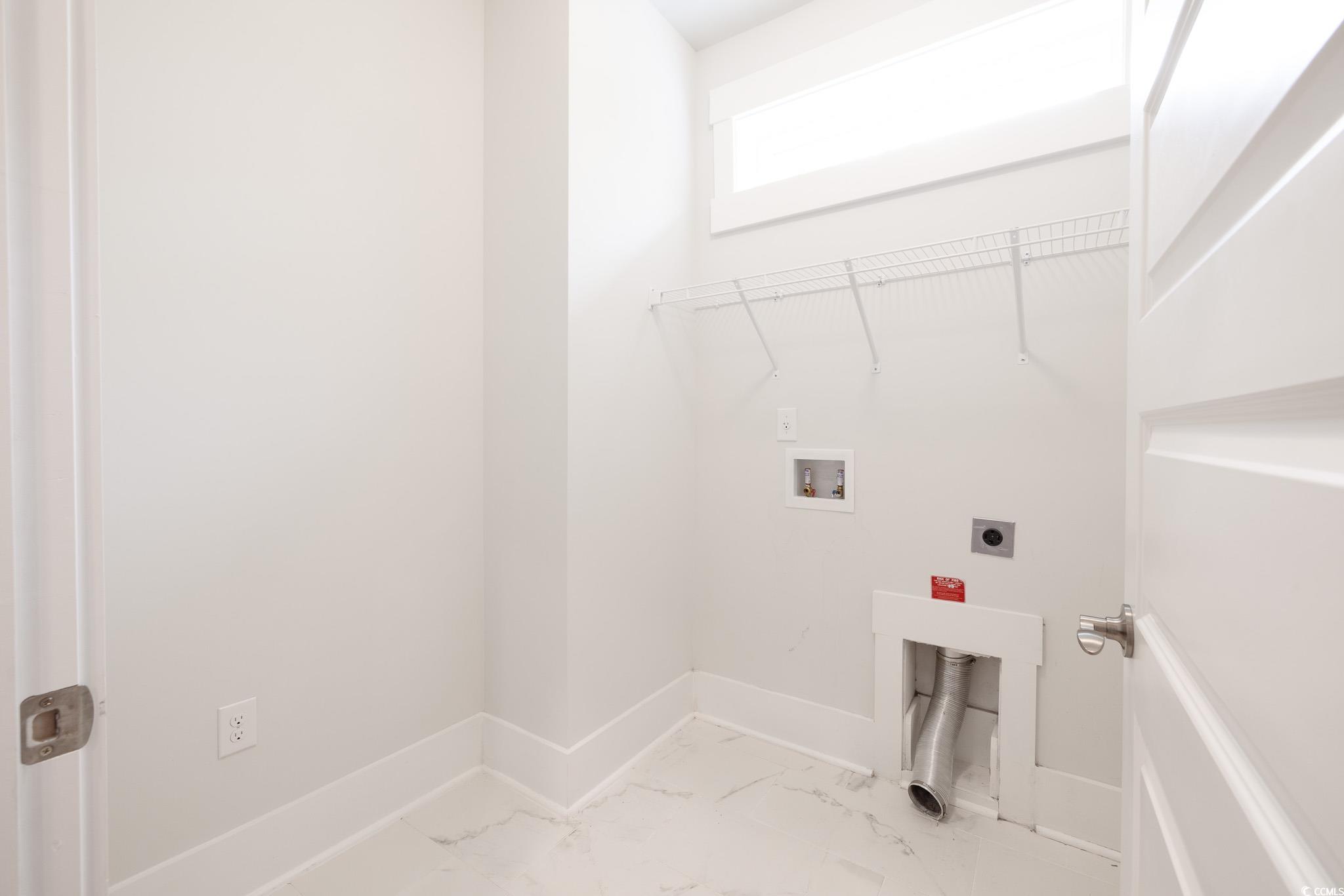 6081 Tramonto Street Myrtle Beach, SC 29577 - Photo 13 of 18 Laundry room with hookup for an electric dryer, washer hookup, and light marble finish floors