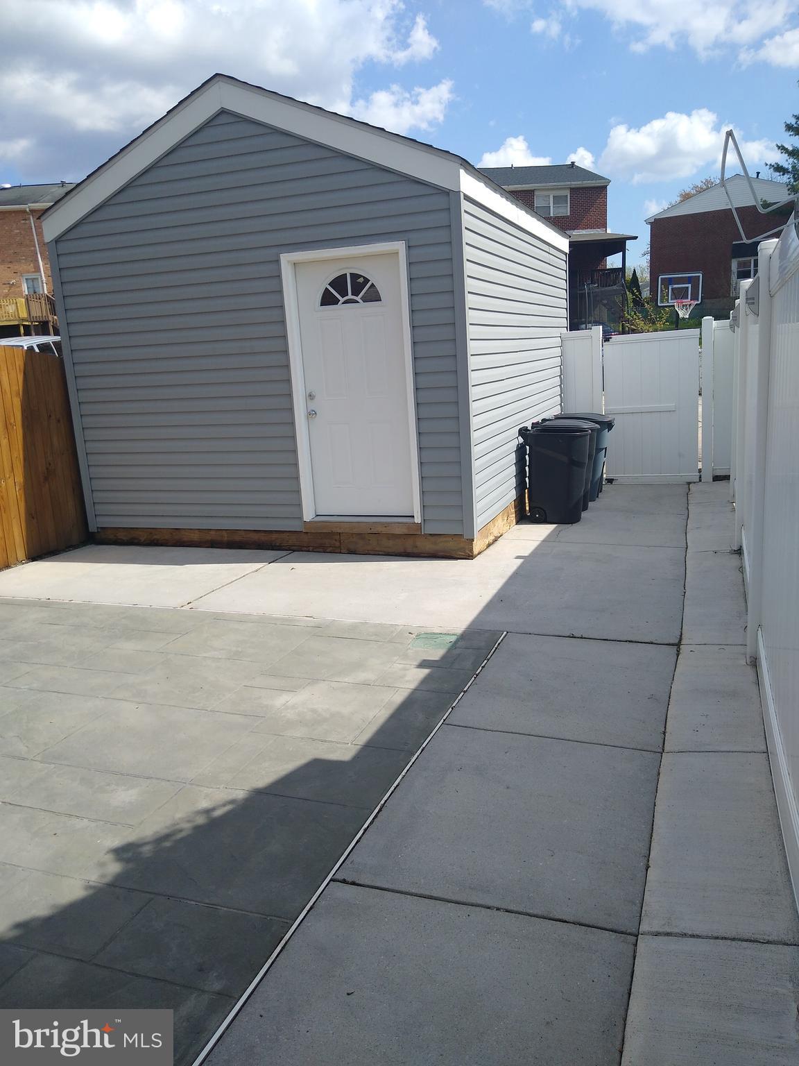 911 Elm Road Baltimore, MD 21227 - Photo 15 of 19 Back Storage Shed 10x16