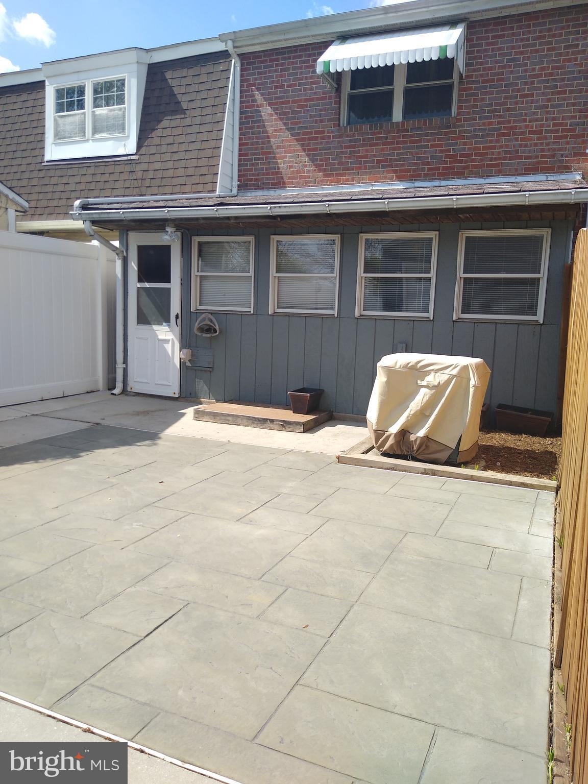 911 Elm Road Baltimore, MD 21227 - Photo 16 of 19 Back Stamped Cement Patio