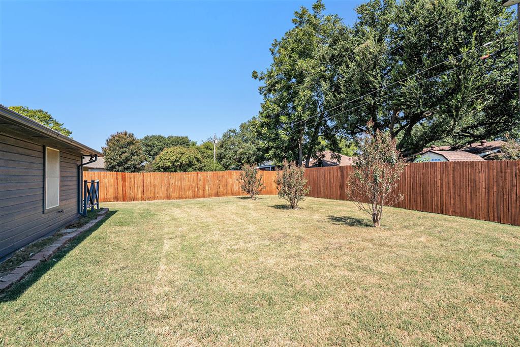602 McAnear Street Cleburne, TX 76033 - Photo 27 of 27 a backyard of a house with a basket ball court