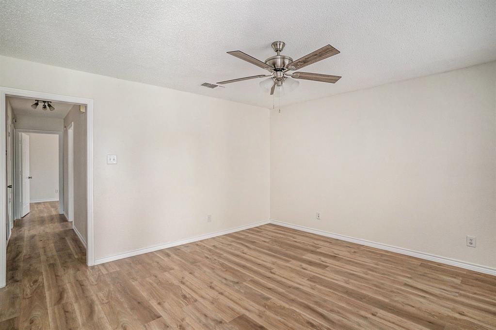 602 McAnear Street Cleburne, TX 76033 - Photo 8 of 27 a view of a room with wooden floor