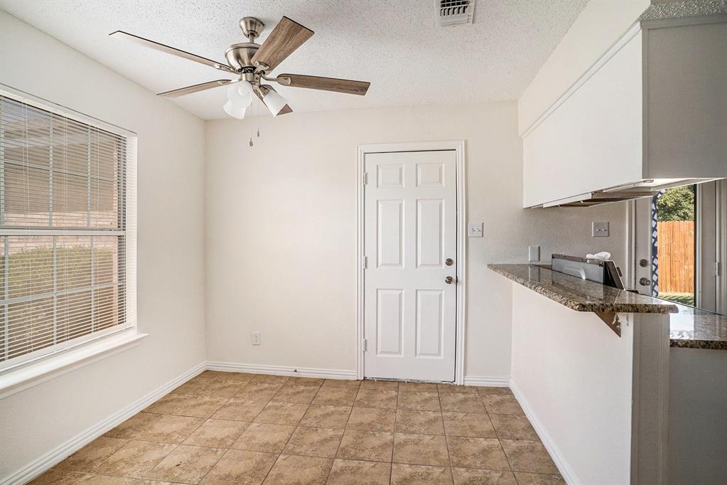 602 McAnear Street Cleburne, TX 76033 - Photo 9 of 27 a view of a kitchen with a sink and a window