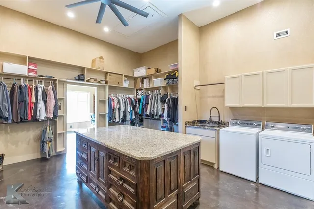 a kitchen with a stove a refrigerator and a sink