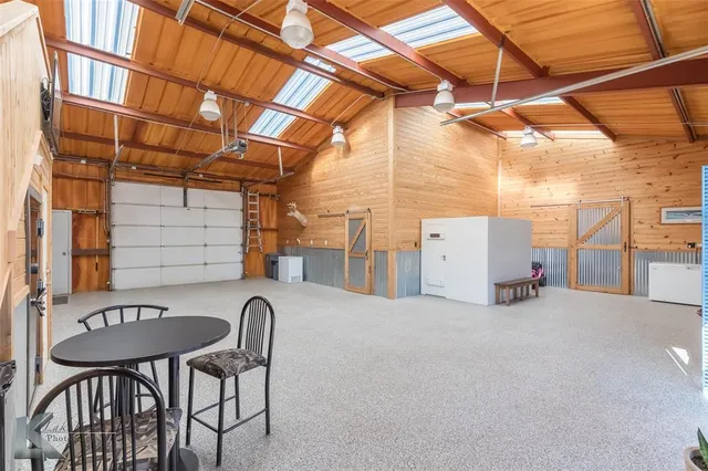 a view of a chair and table in the patio