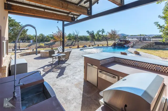 a view of a patio with swimming pool