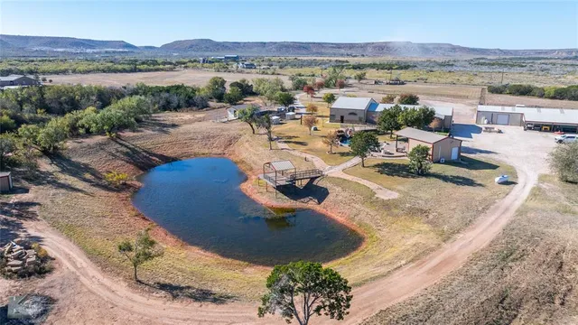an aerial view of a house with outdoor space
