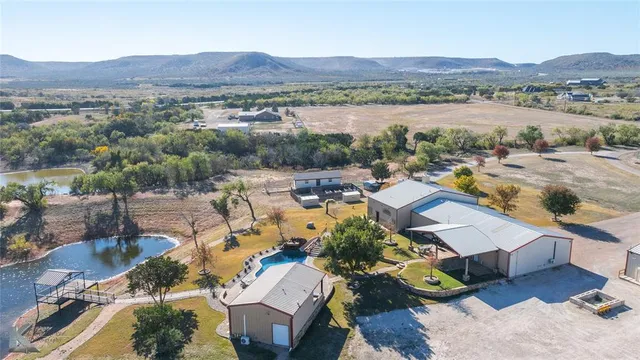 an aerial view of a house with mountain view