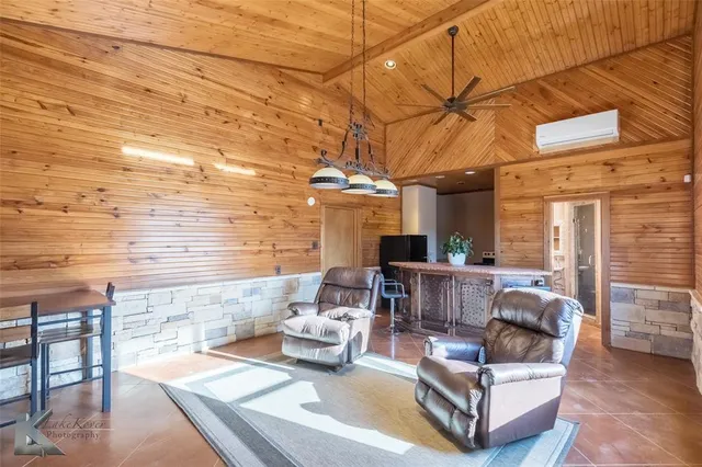 a view of a patio with couches and potted plants