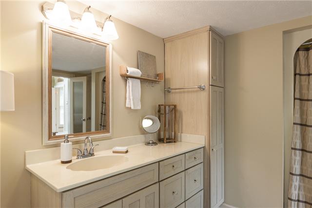 4444 Manners Road Lebanon, TN 37087 - Photo 12 of 20 a bathroom with a double vanity sink and mirror