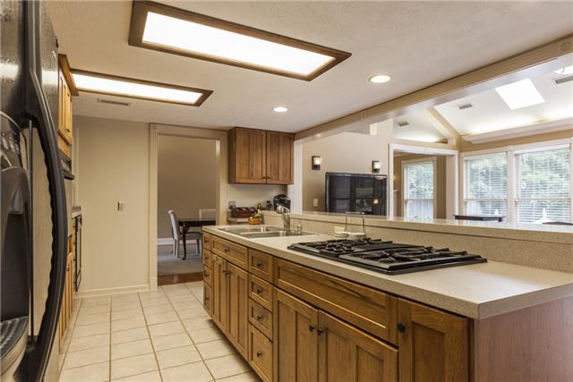 4444 Manners Road Lebanon, TN 37087 - Photo 6 of 20 a kitchen with stainless steel appliances a stove a sink and a refrigerator