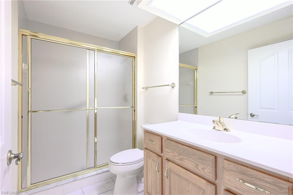 5805 Grande Reserve Way, Unit 1102 Naples, FL 34110 - Photo 21 of 38 a bathroom with a sink toilet and shower