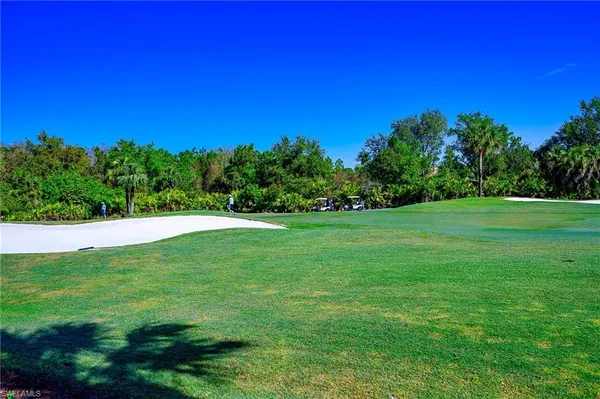 a view of a golf course with a yard