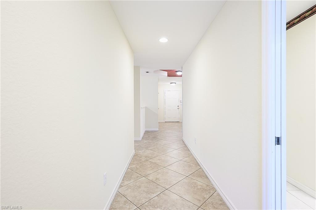 5805 Grande Reserve Way, Unit 1102 Naples, FL 34110 - Photo 5 of 38 a view of a hallway