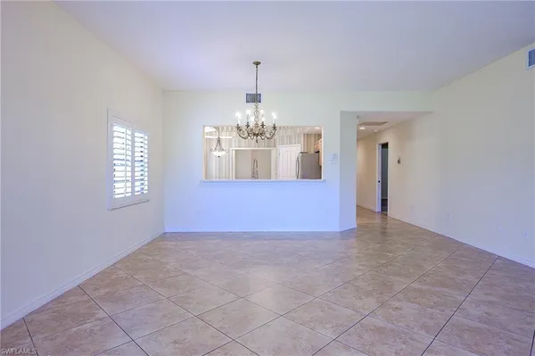 a view of an empty room and window