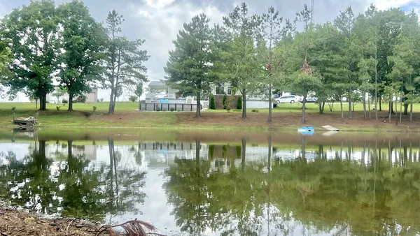a view of lake with green space