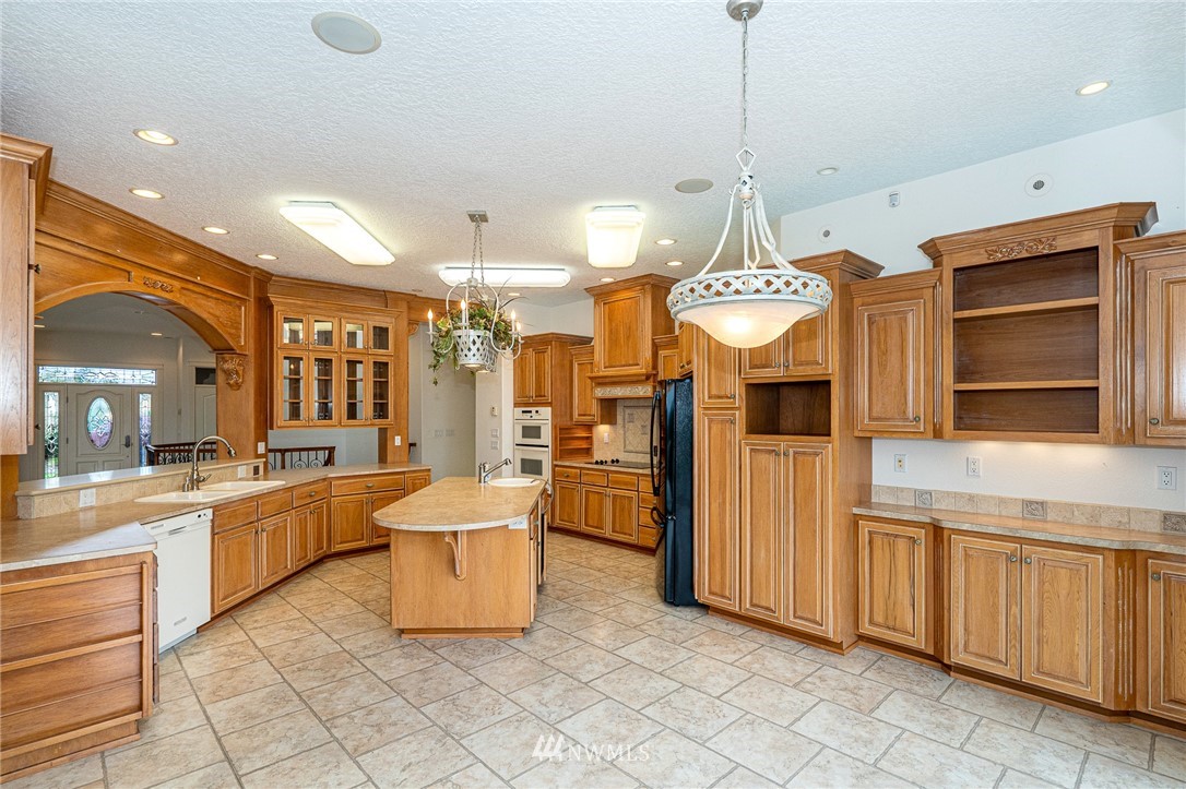 208 Brockway Road Chehalis, WA 98532 - Photo 12 of 40 a large kitchen with kitchen island granite countertop lots of counter top space
