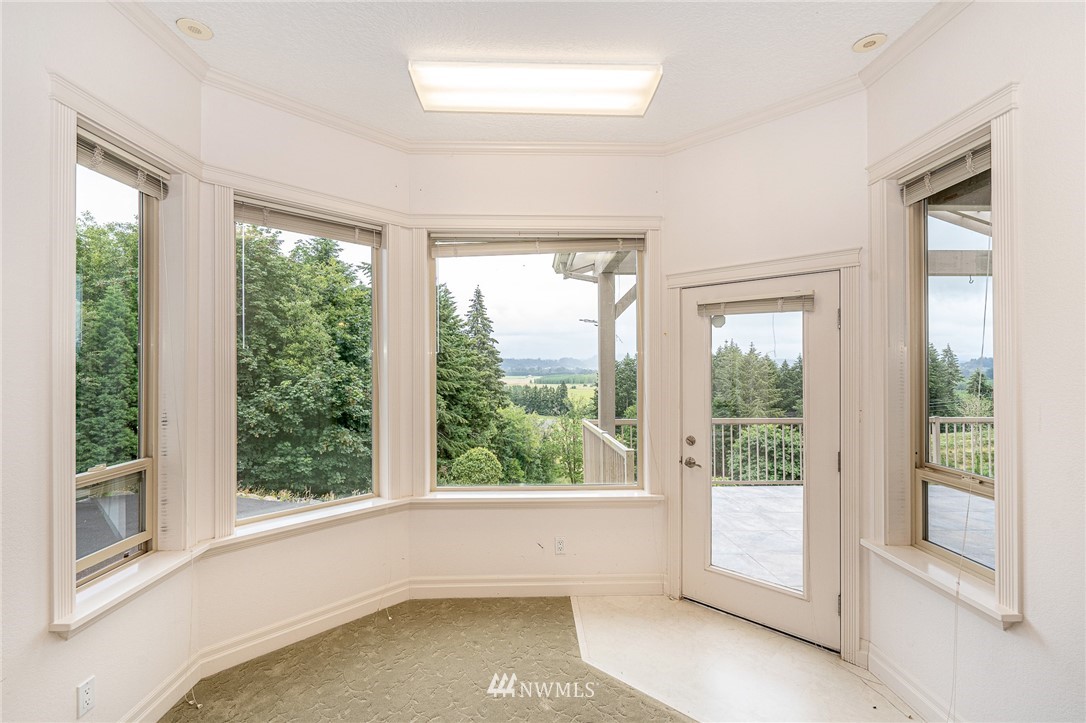 208 Brockway Road Chehalis, WA 98532 - Photo 15 of 40 a view of an empty room with large windows